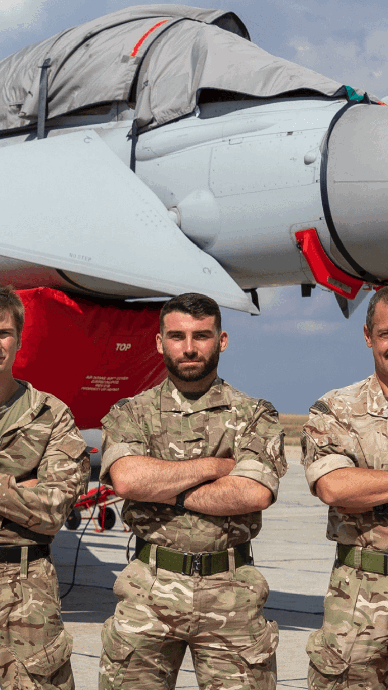 man in army uniform standing in front of a plane man in army uniform standing in front of a plane