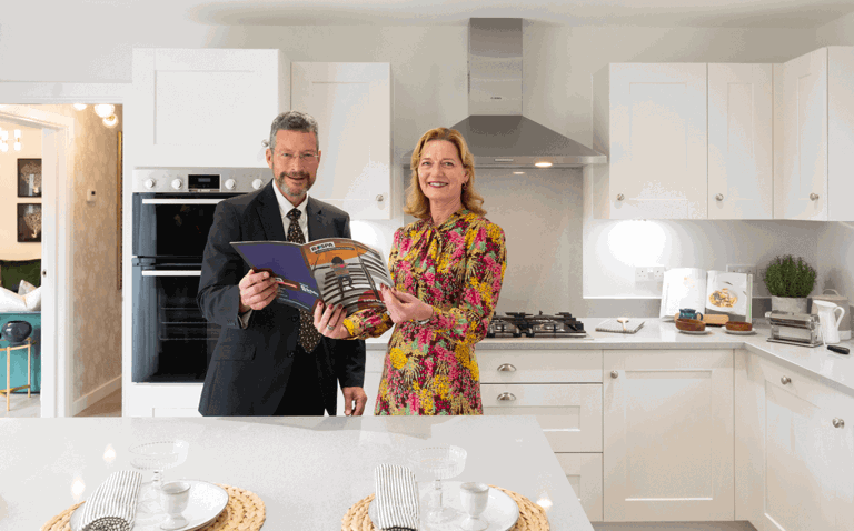 Man and lady standing in a kitchen Man and lady standing in a kitchen
