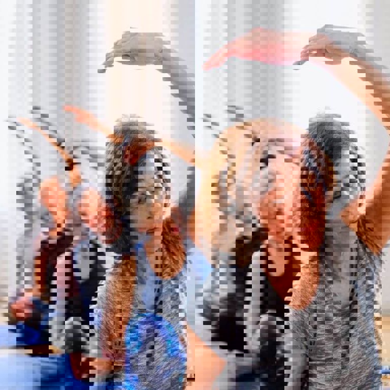 people sitting on the floor doing yoga people sitting on the floor doing yoga