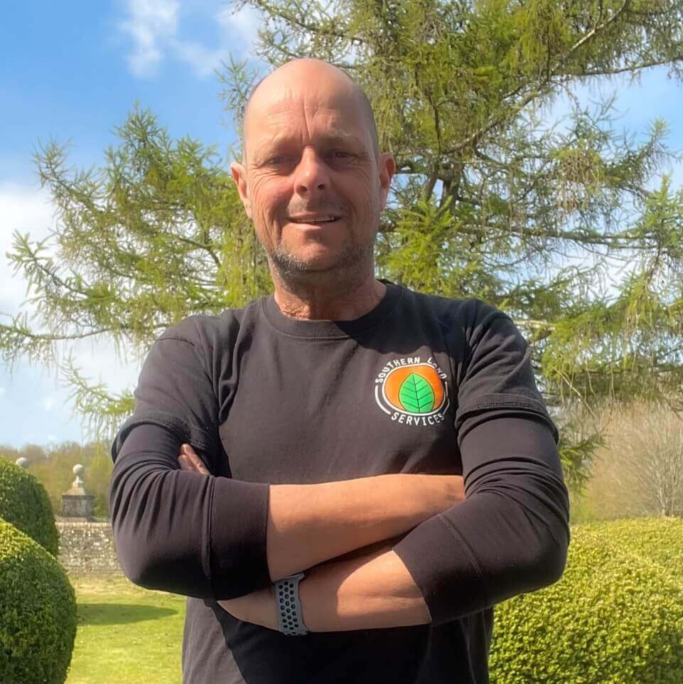 man standing outside with arms crossed