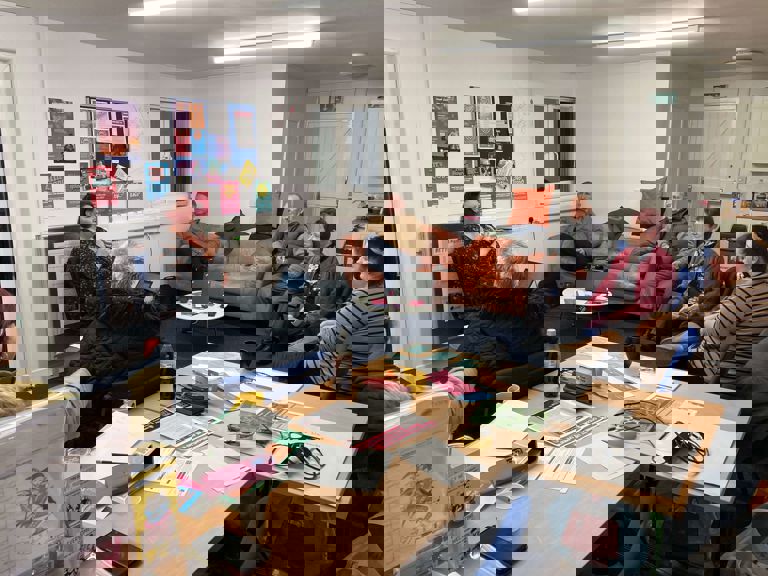 people sitting in a circle in a lounge talking people sitting in a circle in a lounge talking