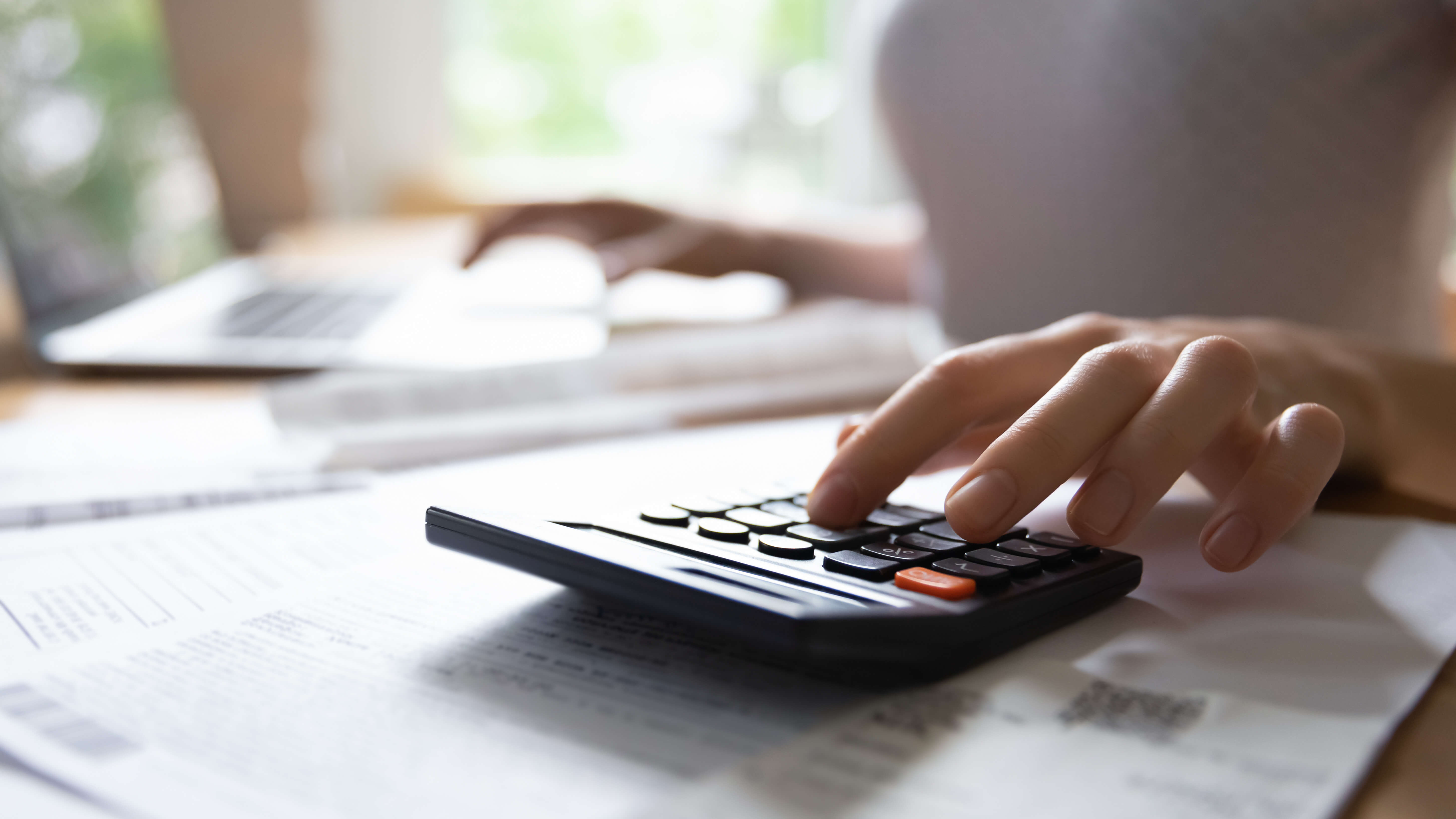 a person using a calculator