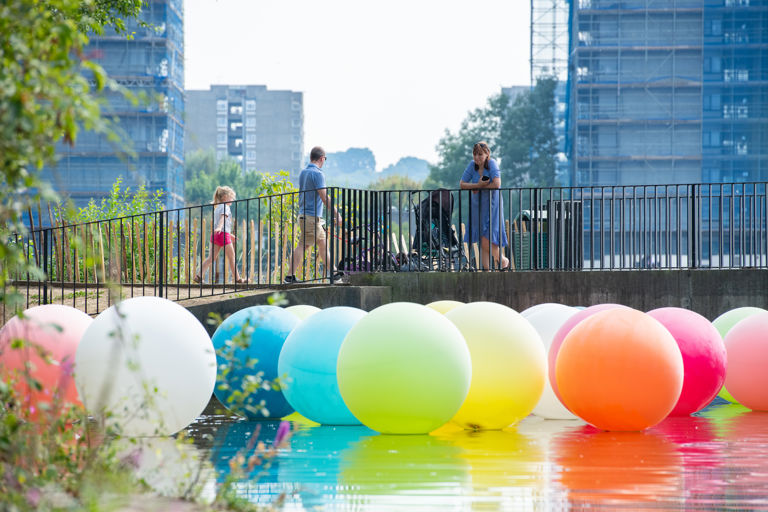 “Balloons” art installation on Southmere Lake by artists Nathalie Coste and Selina Fukuda as part of the Thamesmead Markets in summer 2020 which were led by a group of local residents. “Balloons” art installation on Southmere Lake by artists Nathalie Coste and Selina Fukuda as part of the Thamesmead Markets in summer 2020 which were led by a group of local residents.