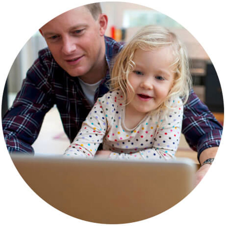 father and daughter looking at a tablet father and daughter looking at a tablet