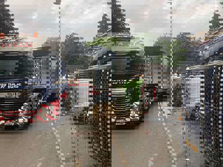 truck in street transporting a glass room truck in street transporting a glass room